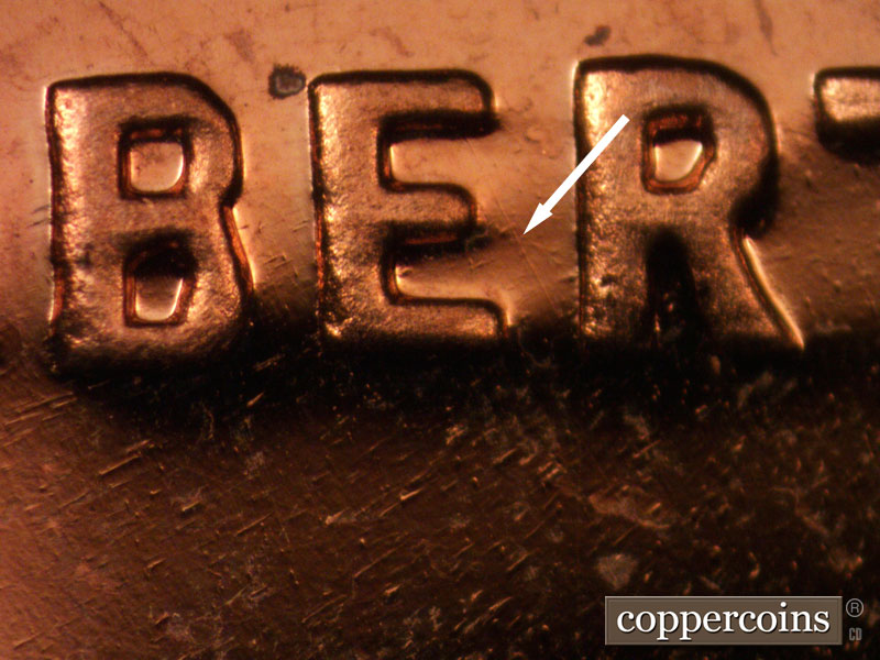 Die-stage B marker on 1963P•1DO•025P (1963 Doubled Die Obverse).