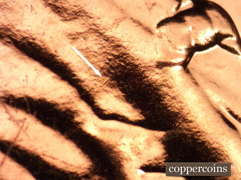 Die-stage B marker on 1963P•1DO•025P (1963 Doubled Die Obverse).