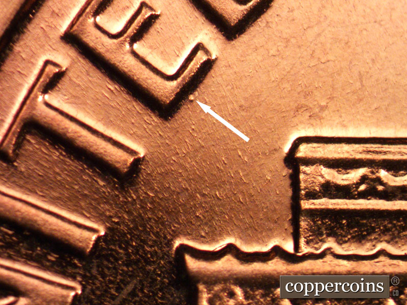 Die-stage B marker on 1963P•1DO•025P (1963 Doubled Die Obverse).
