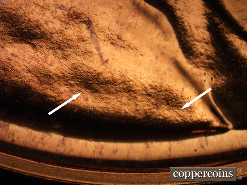 Die-stage B marker on 1963P•1DO•027P (1963 Doubled Die Obverse).