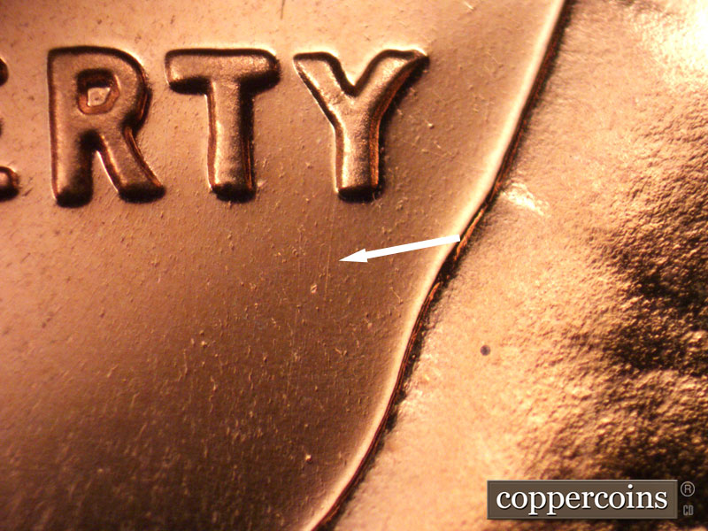 Die-stage B marker on 1963P•1DO•028P (1963 Doubled Die Obverse).