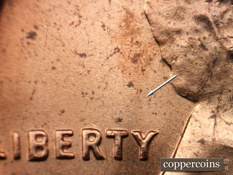 Die-stage B marker on 1963P•1DO•029 (1963 Doubled Die Obverse).
