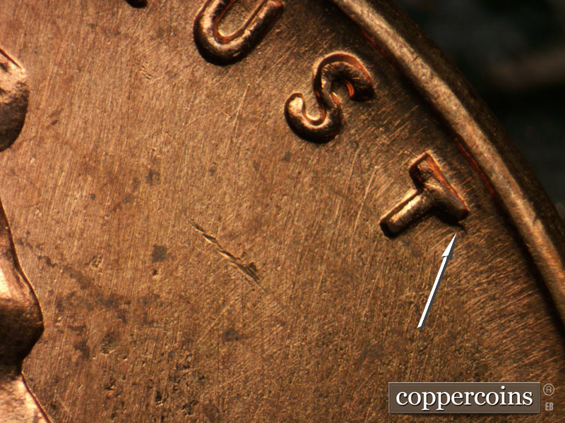 Die-stage B marker on 1963P•1DO•032 (1963 Doubled Die Obverse).