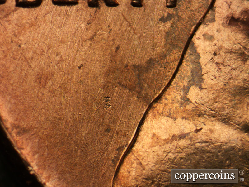 Die-stage B marker on 1963P•1DO•032 (1963 Doubled Die Obverse).