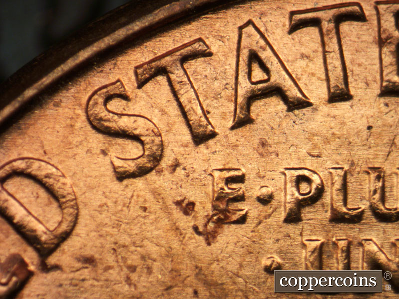 Die-stage B marker on 1963P•1DO•032 (1963 Doubled Die Obverse).