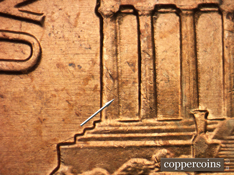 Die-stage B marker on 1963P•1DO•032 (1963 Doubled Die Obverse).