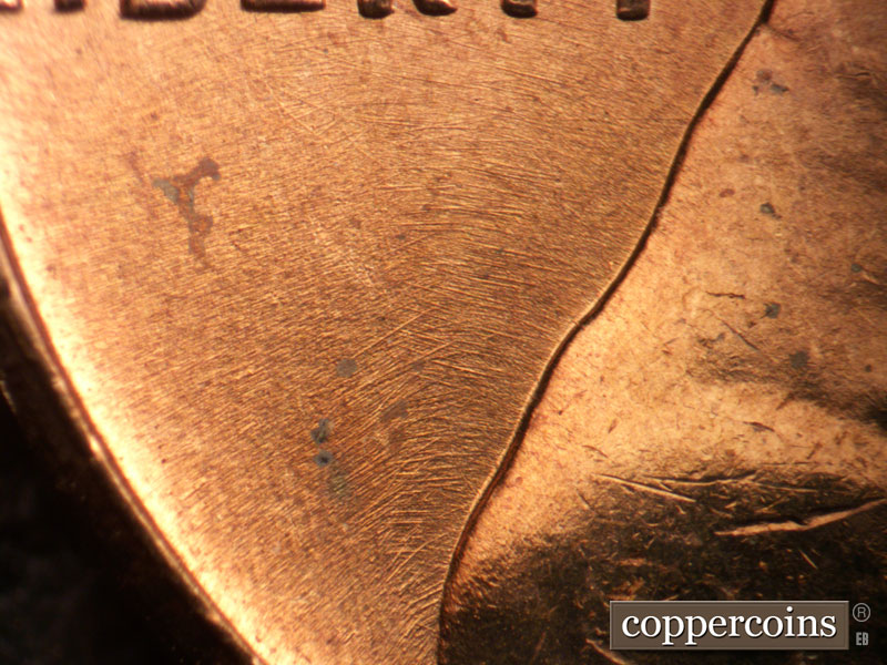 Die-stage B marker on 1963P•1DO•037 (1963 Doubled Die Obverse).