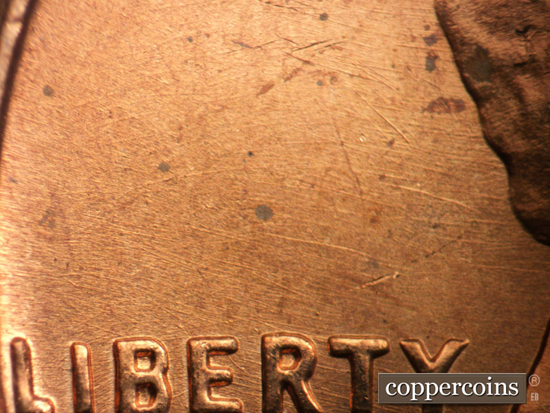 Die-stage B marker on 1963P•1DO•037 (1963 Doubled Die Obverse).