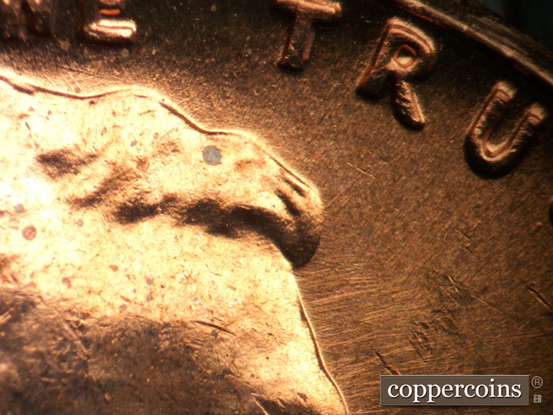 Die-stage B marker on 1963P•1DO•037 (1963 Doubled Die Obverse).