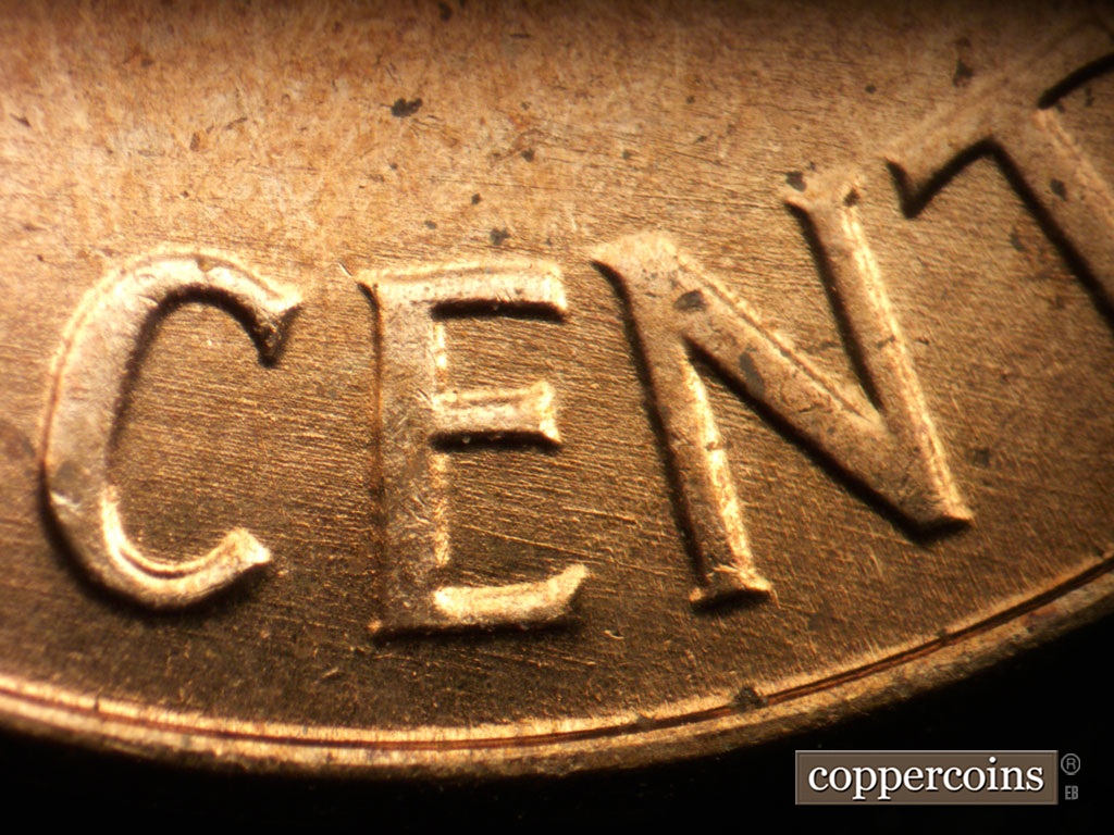 Die-stage B marker on 1963P•1DO•042 showing ESE die scratches through CENT.