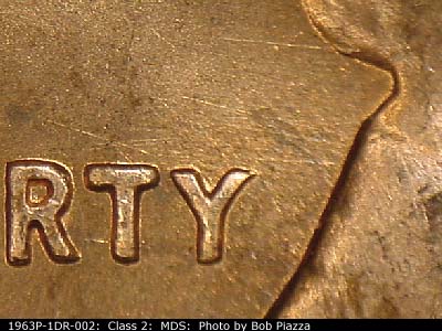 Die-stage B marker on 1963P•1DR•002 (1963 Doubled Die Reverse).