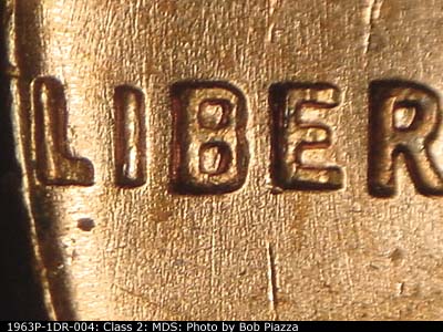 Die-stage B marker on 1963P•1DR•004 (1963 Doubled Die Reverse).