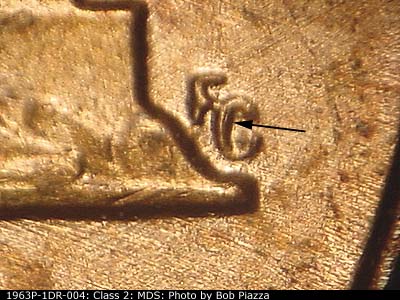 Die-stage B marker on 1963P•1DR•004 (1963 Doubled Die Reverse).