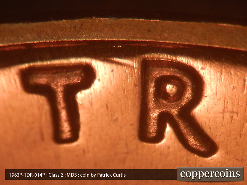 Die-stage B marker on 1963P•1DR•014P (1963 Doubled Die Reverse).