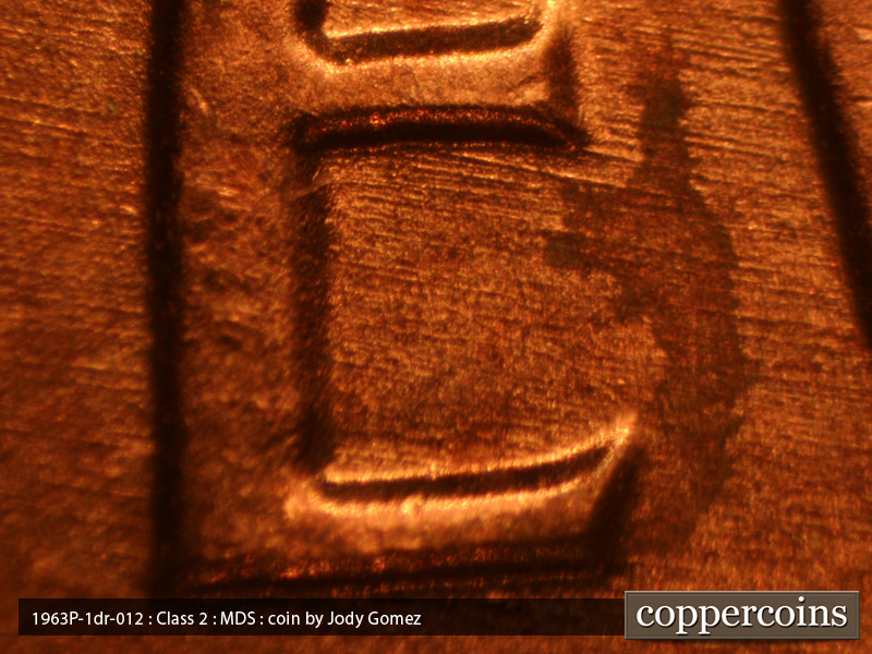 Die-stage B marker on 1963P•1DR•019 (1963 Doubled Die Reverse).