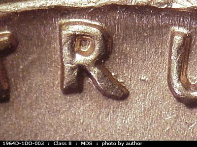 Die-stage B marker on 1964D•1DO•003 (1964 Doubled Die Obverse).