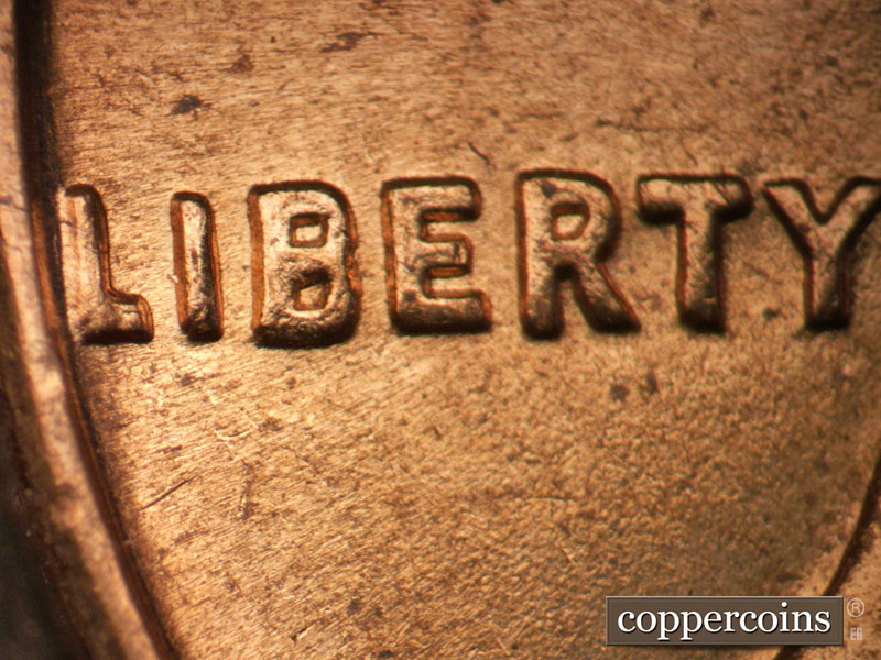 Die-stage B marker on 1964D•1DO•009 (1964 Doubled Die Obverse).