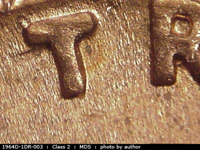 Die-stage B marker on 1964D•1DR•003 (1964 Doubled Die Reverse).