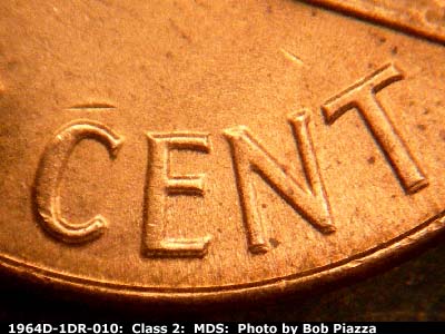 Die-stage B marker on 1964D•1DR•010 (1964 Doubled Die Reverse).