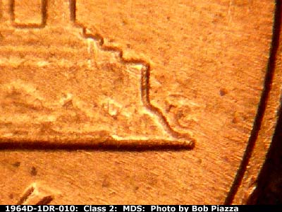 Die-stage B marker on 1964D•1DR•010 (1964 Doubled Die Reverse).