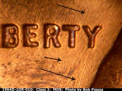 Die-stage B marker on 1964D•1DR•010 (1964 Doubled Die Reverse).
