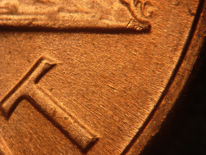 Die-stage B marker on 1964D•1DR•012 (1964 Doubled Die Reverse).