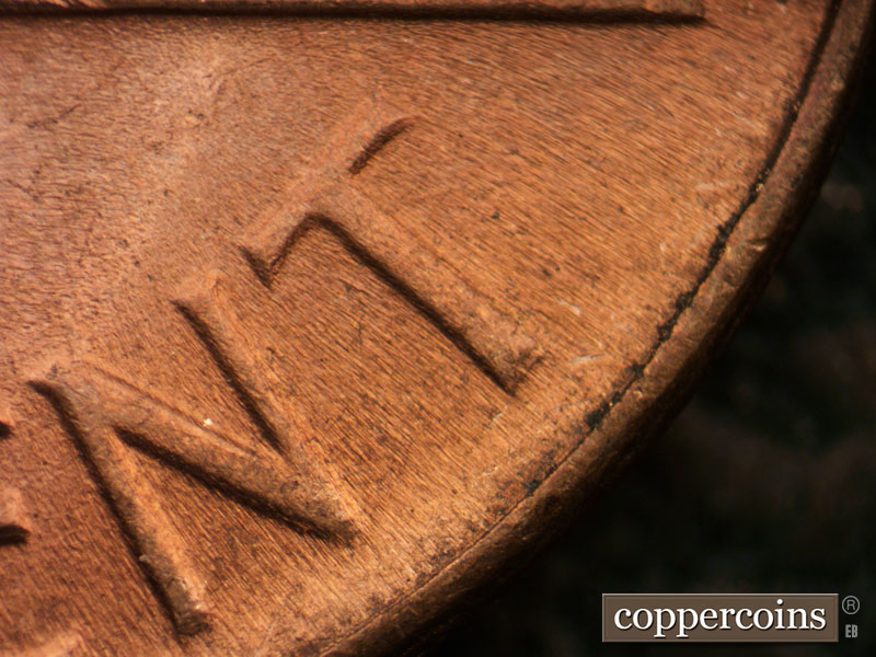 Die-stage C marker on 1964D•1DR•015 (1964 Doubled Die Reverse).