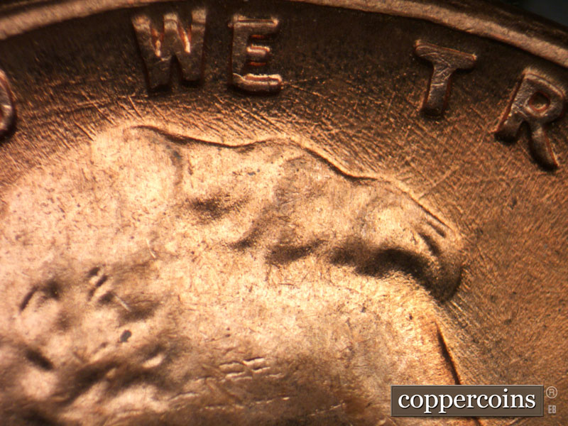 Die-stage C marker on 1964D•1DR•015 (1964 Doubled Die Reverse).