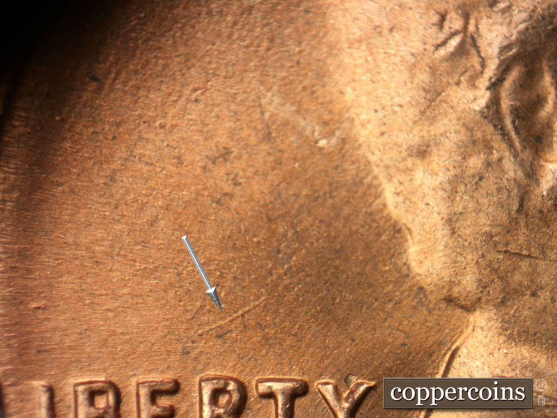 Die-stage B marker on 1964D•1DR•016 (1964 Doubled Die Reverse).