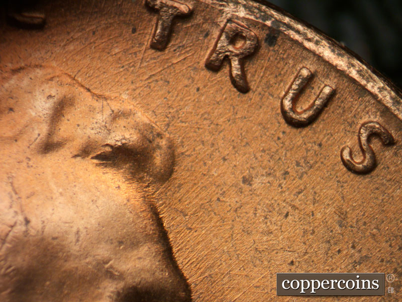 Die-stage C marker on 1964D•1DR•017 (1964 Doubled Die Reverse).