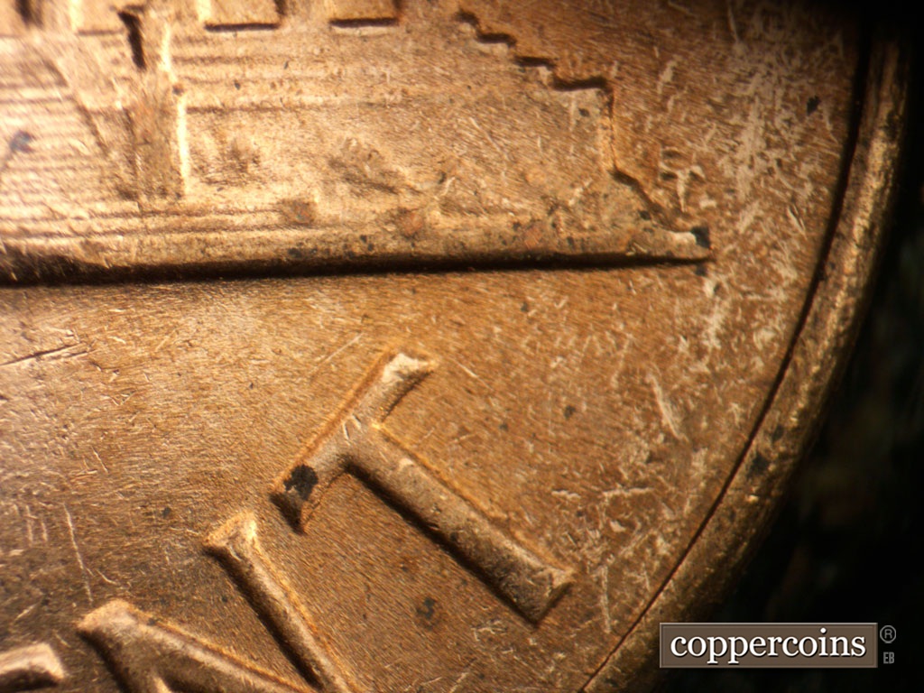 Die-stage B marker on 1964D•1DR•018 showing Doubling on right base.