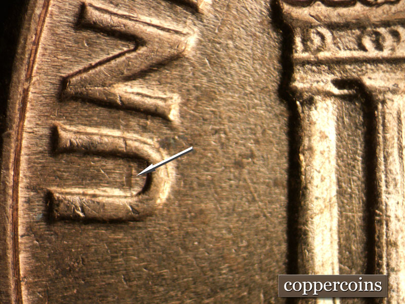 Die-stage B marker on 1964D•1MM•002 (1964 Repunched Mint Mark).