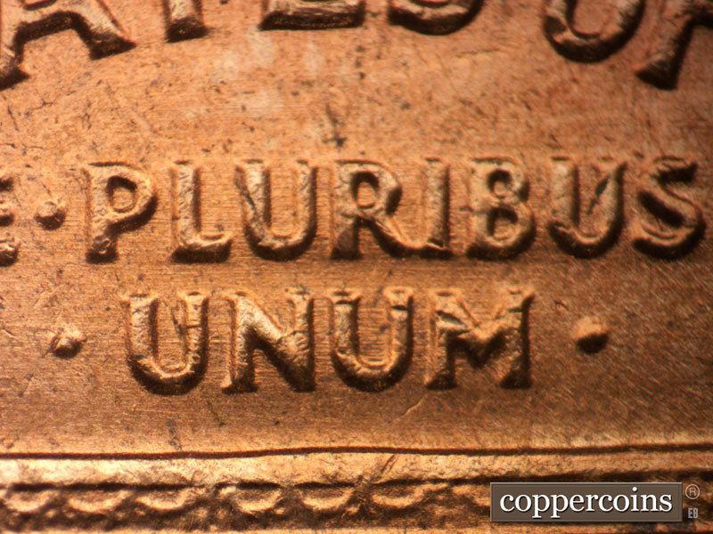 Die-stage B marker on 1964D•1MM•005 showing Die scratches through E PLURIBUS UNUM.