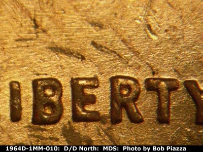 Die-stage B marker on 1964D•1MM•010 (1964 Repunched Mint Mark).