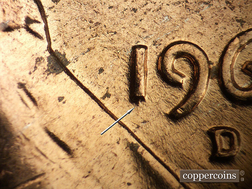 Die-stage B marker on 1964D•1MM•014 showing Die gouge from bottom of 1 in date.