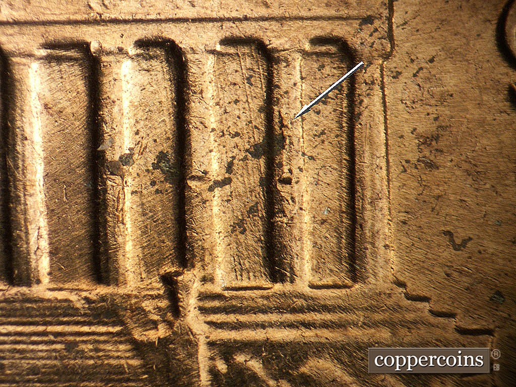 Die-stage B marker on 1964D•1MM•014 showing Die chipping on coulumn 11.