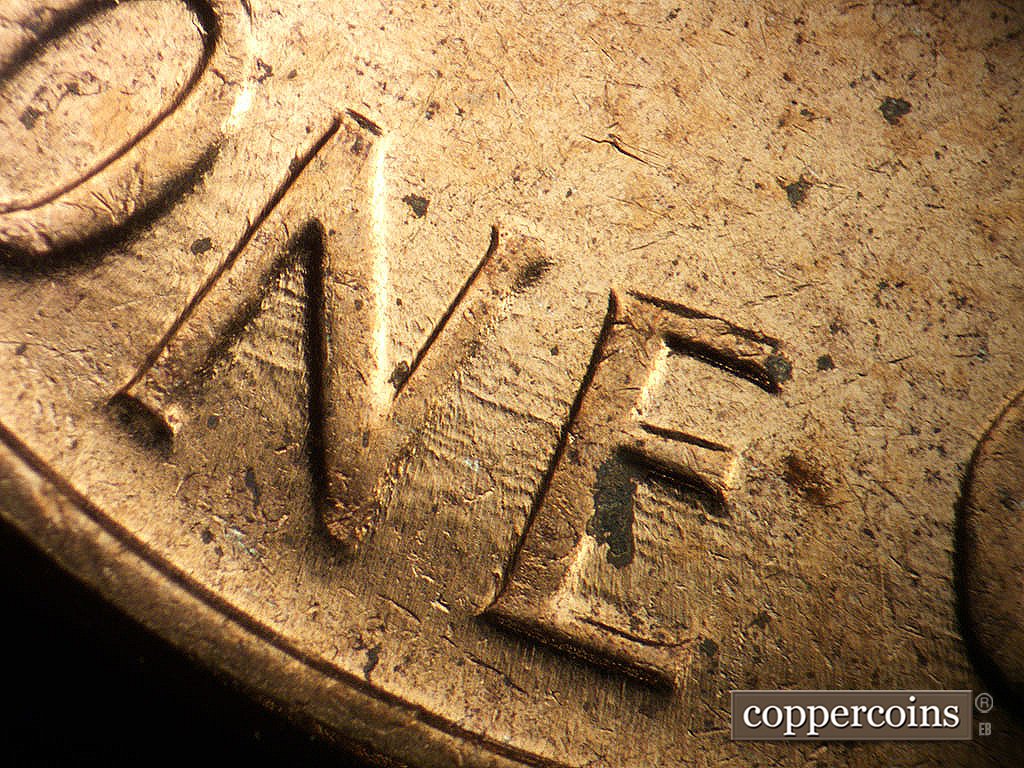 Die-stage B marker on 1964D•1MM•014 showing SE die scratches through ONE.