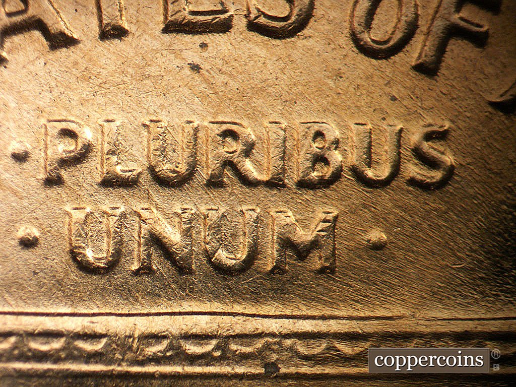Die-stage B marker on 1964D•1MM•040 showing NW die scratches through E PLURIBUS UNUM.