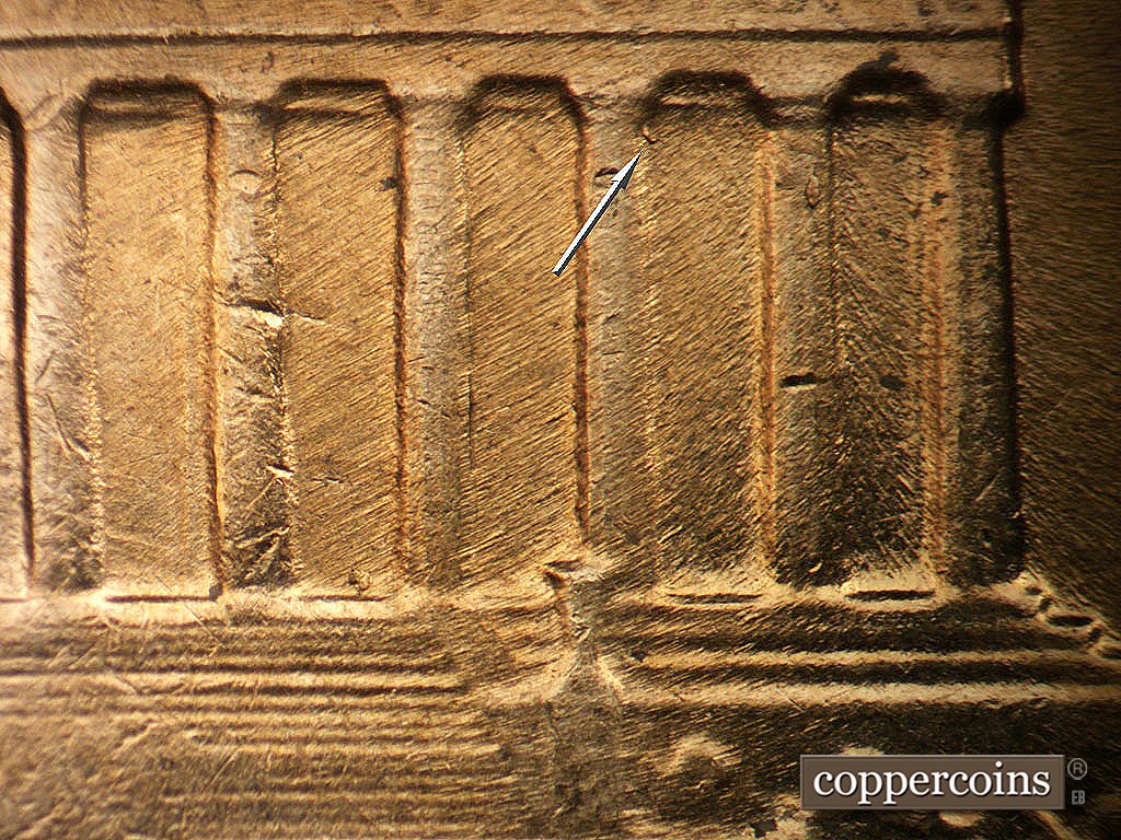 Die-stage B marker on 1964D•1MM•040 showing Small die chip in top of bay 10, SE die scratches in bay 11.