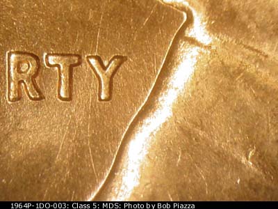 Die-stage B marker on 1964P•1DO•003 (1964 Doubled Die Obverse).