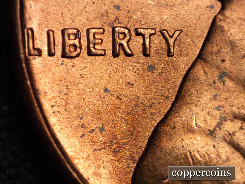 Die-stage B marker on 1964P•1DO•005 (1964 Doubled Die Obverse).