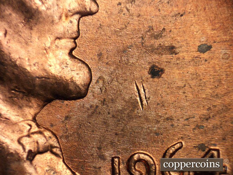 Die-stage B marker on 1964P•1DO•005 (1964 Doubled Die Obverse).