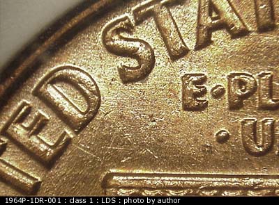 Die-stage C marker on 1964P•1DR•001 (1964 Doubled Die Reverse).
