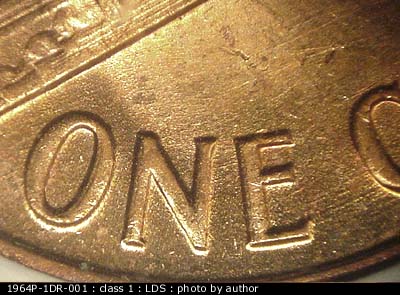 Die-stage C marker on 1964P•1DR•001 (1964 Doubled Die Reverse).
