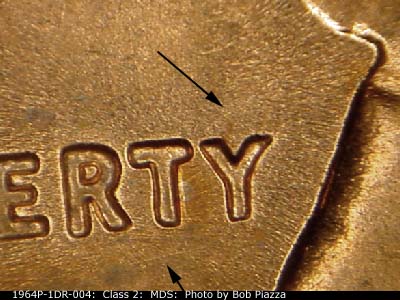 Die-stage B marker on 1964P•1DR•004 (1964 Doubled Die Reverse).