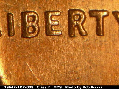 Die-stage B marker on 1964P•1DR•008 (1964 Doubled Die Reverse).