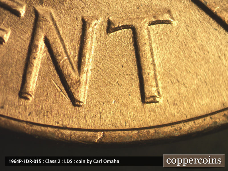 Die-stage C marker on 1964P•1DR•015 (1964 Doubled Die Reverse).