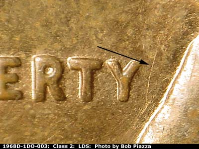 Die-stage C marker on 1968D•1DO•003 (1968 Doubled Die Obverse).