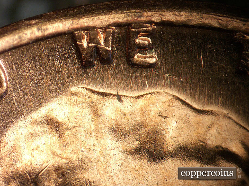 Die-stage A marker on 1968S•1DO•011 showing Light extra thickness on WE.