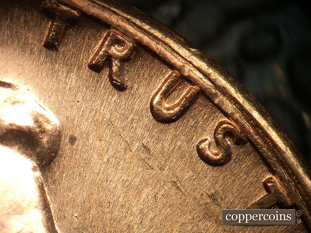 Die-stage A marker on 1968S•1DO•011 showing Light extra thickness on TRUST.